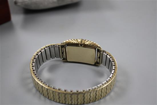 A gentlemans 1950s 10k gold filled Bulova Westover clam shell cased manual wind wrist watch.
